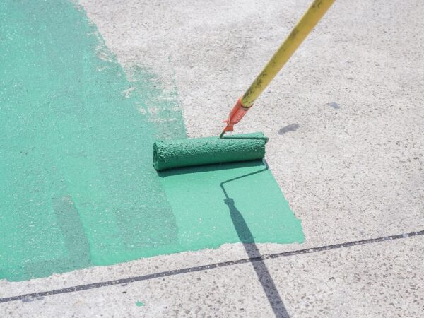 Painter applying paint with a roller