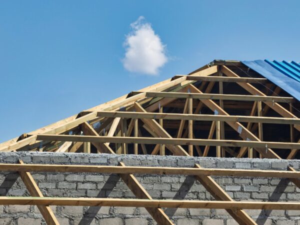 Unfinished wooden roof trusses and beams
